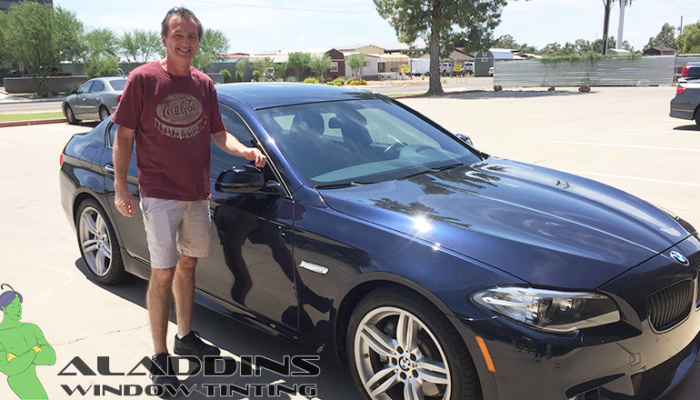 2015 bmw 535i crystalline 40-70 customer next to car