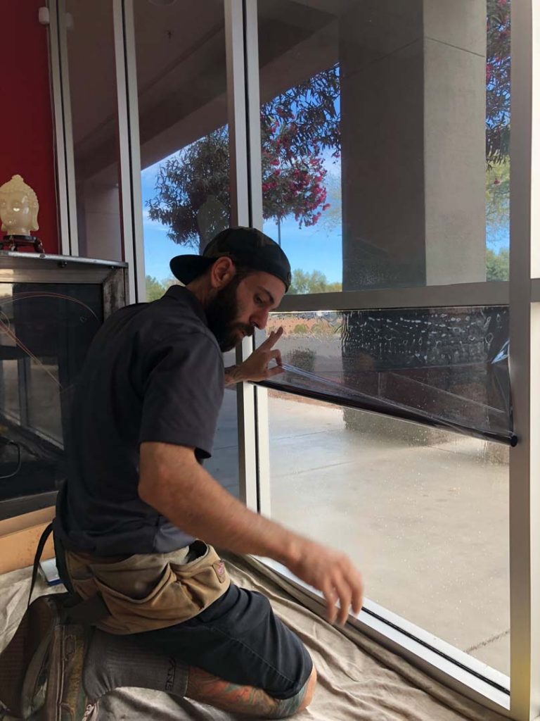 architectural film being installed on Commerical storefront