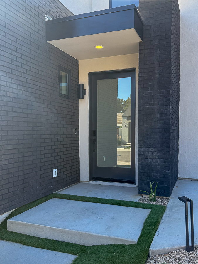 Frosted privacy film on a home’s glass front door, obscuring the view inside while allowing natural light through.