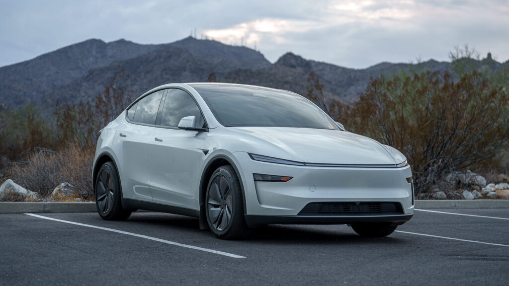 Tesla Model Y with the White Tank Mountains in the West Valley, Arizona
